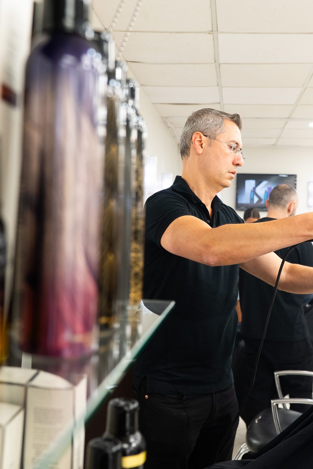 Colorist mixing formula at Salon Icon NYC