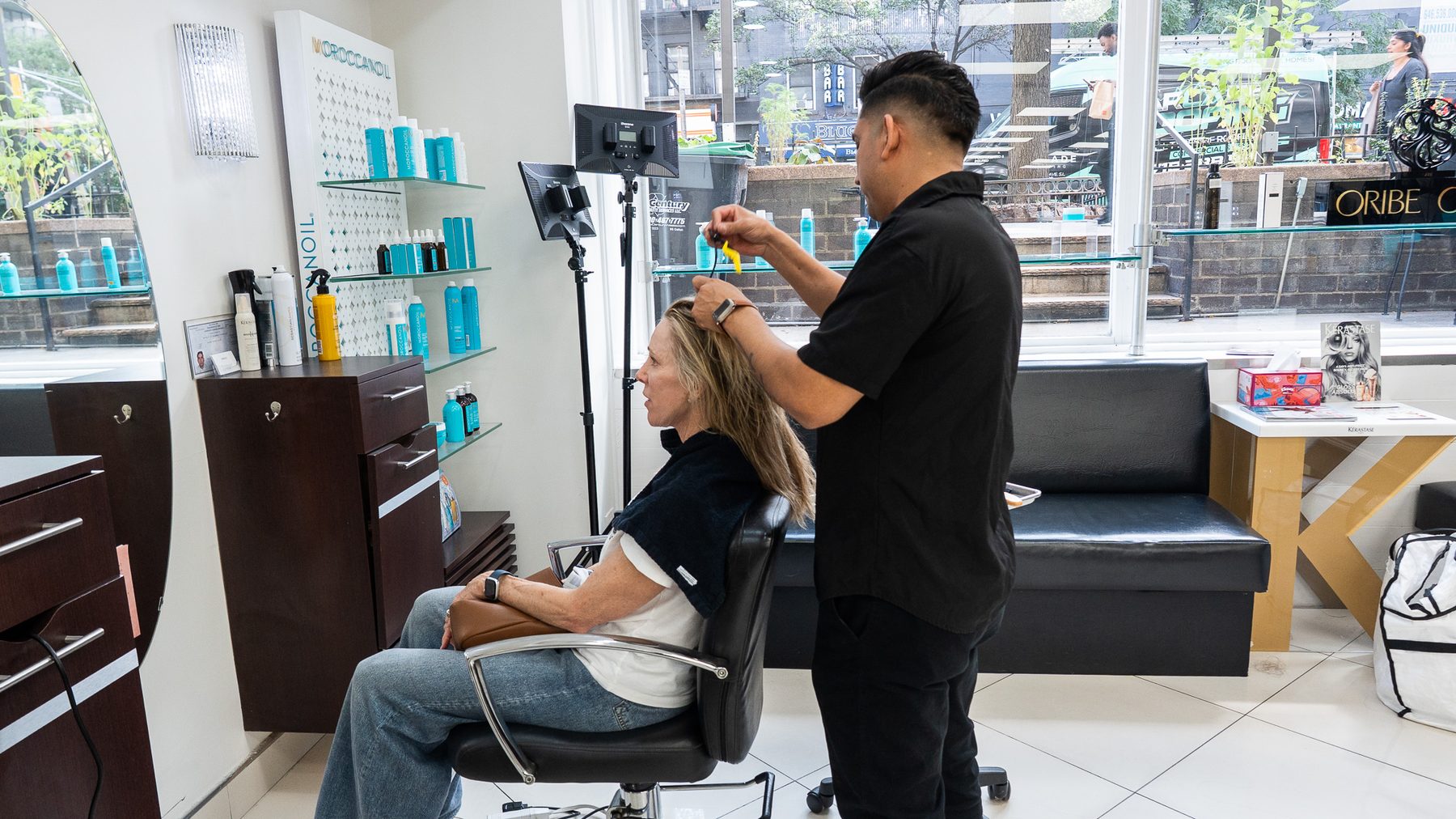 Colorist applying foils by the window at Salon Icon NYC